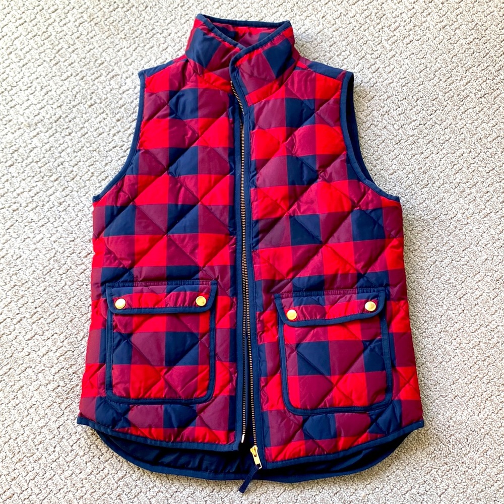 Red and navy plaid puffer vest with gold zipper and buttons